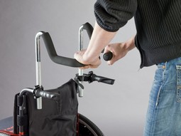 Forhøjer til skubbehåndtag på kørestol