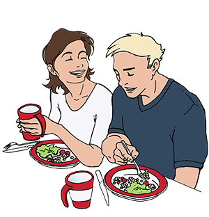 Kvinde og mand ved et måltid