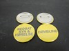 Round yellow badge with needle and the text: DEAFBLIND Round yellow badge with needle and the text: DEAFBLIND