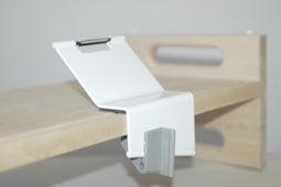 Potato peeler clamped to a table or worktop