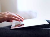 Photo of a person operating a hand-held computer.