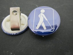 Badge with white man and clamp