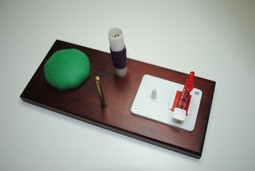 Needle threader on a board