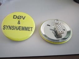 Yellow badge with clips Text: Deaf and visually impaired Yellow badge with clips Text: Deaf and visually impaired