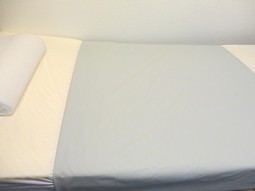 Comfor Incontinence sheet in light grey with PUR surface