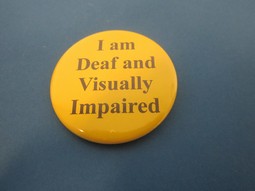 Yellow badge with needle and english text Yellow badge with needle and english text